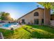 Refreshing pool and grassy backyard with patio furniture at 13128 N 104Th Pl, Scottsdale, AZ 85260