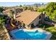 Aerial view showcasing a house with a pool and mountain views at 13128 N 104Th Pl, Scottsdale, AZ 85260