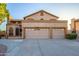 Two-story home with three-car garage and desert landscaping at 13128 N 104Th Pl, Scottsdale, AZ 85260