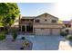 Two-story house with a double garage and mature landscaping at 13128 N 104Th Pl, Scottsdale, AZ 85260