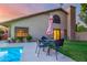 Inviting pool area with patio furniture and lush landscaping at 13128 N 104Th Pl, Scottsdale, AZ 85260