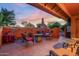 Relaxing patio with fire pit, seating, and southwestern style at 13128 N 104Th Pl, Scottsdale, AZ 85260