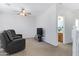 Open loft area with two reclining chairs and a view of the bathroom at 26853 N 176Th Dr, Surprise, AZ 85387