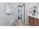 Bathroom features a tub, shower, and double vanity at 26853 N 176Th Dr, Surprise, AZ 85387