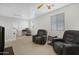 Versatile loft space with seating, a workspace, and a view into a bedroom at 26853 N 176Th Dr, Surprise, AZ 85387