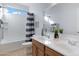 Shared bathroom with double vanity and shower/tub combo at 26853 N 176Th Dr, Surprise, AZ 85387