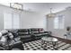 Bright living room with sectional sofa and large windows at 26853 N 176Th Dr, Surprise, AZ 85387