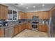 Modern kitchen featuring stainless steel appliances and ample cabinet space at 26853 N 176Th Dr, Surprise, AZ 85387
