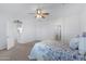 Spacious bedroom with carpeted floor and ceiling fan at 26853 N 176Th Dr, Surprise, AZ 85387