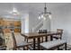 Spacious dining area with a farmhouse-style table and kitchen view at 26853 N 176Th Dr, Surprise, AZ 85387