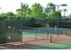 Tennis players enjoying a game on the community court at 27587 N Makena Pl, Peoria, AZ 85383