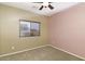 Spacious bedroom with ceiling fan, window blinds, and two-toned walls at 4405 E Peach Tree Dr, Chandler, AZ 85249