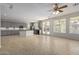 Modern kitchen boasts gray cabinets, granite countertops, and stainless steel appliances at 13635 W Calavar Rd, Surprise, AZ 85379