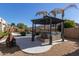 Hot tub with gazebo and pool in background at 13635 W Calavar Rd, Surprise, AZ 85379