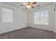 Bright bedroom with neutral carpeting and window blinds at 13635 W Calavar Rd, Surprise, AZ 85379