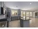 Modern kitchen with stainless steel appliances and granite countertops at 13635 W Calavar Rd, Surprise, AZ 85379