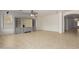 Spacious living room featuring tile floors and access to hallway at 13635 W Calavar Rd, Surprise, AZ 85379