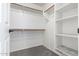 Bright walk-in closet with custom shelving and hanging space at 13635 W Calavar Rd, Surprise, AZ 85379