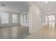 Hallway with herringbone pattern flooring and access to other rooms at 13635 W Calavar Rd, Surprise, AZ 85379
