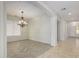 Formal dining room featuring a chandelier and herringbone floors at 13635 W Calavar Rd, Surprise, AZ 85379