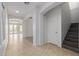 Spacious entryway with tile flooring, staircase, and access to other areas at 13635 W Calavar Rd, Surprise, AZ 85379