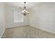 Bright dining room with chandelier and herringbone-patterned floors at 13635 W Calavar Rd, Surprise, AZ 85379