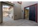 Small side patio with sliding glass door and gate to backyard at 13635 W Calavar Rd, Surprise, AZ 85379