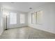 Bright office with herringbone flooring, large windows, and built-in shelving at 13635 W Calavar Rd, Surprise, AZ 85379