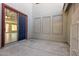 Small side patio with sliding glass door to interior at 13635 W Calavar Rd, Surprise, AZ 85379