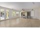Gathering room with sliding glass doors, built-in shelving, and ceiling fan at 13635 W Calavar Rd, Surprise, AZ 85379