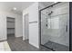 Modern bathroom with a large walk-in shower and marble tile at 13635 W Calavar Rd, Surprise, AZ 85379