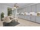 Eat-in kitchen with gray cabinets and a charming dining area at 13635 W Calavar Rd, Surprise, AZ 85379