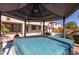 Hot tub under covered patio gazebo, near pool and backyard at 13635 W Calavar Rd, Surprise, AZ 85379