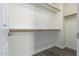 Spacious walk-in closet with double hanging rods at 13635 W Calavar Rd, Surprise, AZ 85379