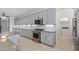 Kitchen with gray cabinets, granite countertops, and ample storage at 13635 W Calavar Rd, Surprise, AZ 85379