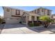 Two-story home with attached garage at 13635 W Calavar Rd, Surprise, AZ 85379