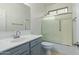 Clean bathroom with gray vanity, shower/tub combo, and tiled floor at 13635 W Calavar Rd, Surprise, AZ 85379