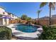 Beautiful kidney-shaped pool, waterfall feature, and ample patio space at 13635 W Calavar Rd, Surprise, AZ 85379
