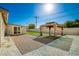 Backyard patio with artificial turf and pergola at 101 W Shannon St, Chandler, AZ 85225