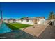 Large backyard with gravel, artificial turf, and pergola at 101 W Shannon St, Chandler, AZ 85225