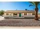 Newly renovated single-story home with a teal door and gravel landscaping at 101 W Shannon St, Chandler, AZ 85225