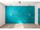 Bedroom with teal accent wall and modern pendant lights at 101 W Shannon St, Chandler, AZ 85225