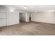 Open living room with neutral walls and carpet flooring, leading to other rooms at 101 W Shannon St, Chandler, AZ 85225