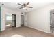 Bright bedroom with mirrored closet doors and ceiling fan at 101 W Shannon St, Chandler, AZ 85225