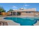 Relaxing kidney-shaped pool with a wooden pergola at 5849 W Monte Cristo Ave, Glendale, AZ 85306