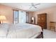 Spacious bedroom with large bed, dresser, and ample natural light at 19620 N Majestic Vista Ct, Surprise, AZ 85387