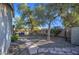 Landscaped backyard with flagstone pathway and mature trees at 13719 W Marissa Dr, Litchfield Park, AZ 85340