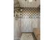 Large walk-in shower with unique tile work and built-in bench at 6717 E Solano Dr, Paradise Valley, AZ 85253