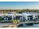 Aerial view of modern homes near a lake at 6154 E Alta Hacienda Dr, Scottsdale, AZ 85251