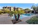 Community pool with lounge chairs and palms at 19777 N 76Th St # 2190, Scottsdale, AZ 85255